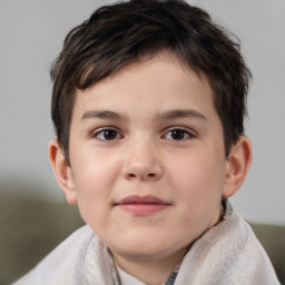 Joyful white child male with short  brown hair and brown eyes