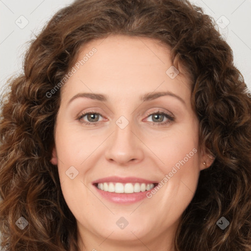 Joyful white young-adult female with long  brown hair and green eyes