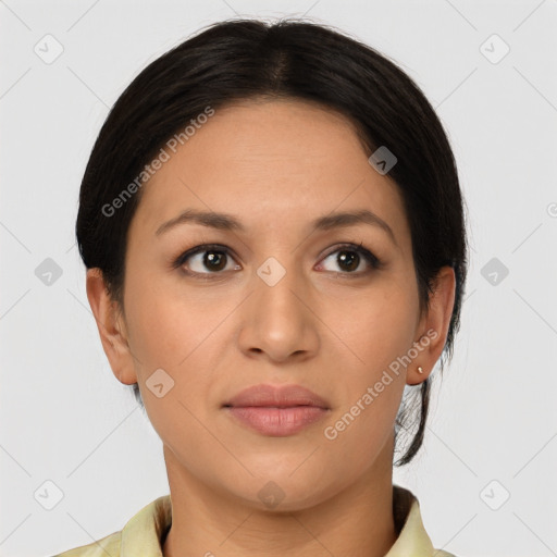 Joyful latino young-adult female with short  brown hair and brown eyes