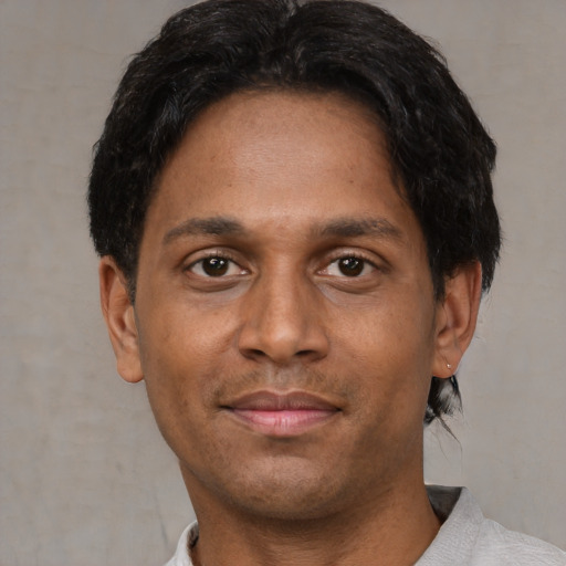 Neutral latino young-adult male with short  brown hair and brown eyes