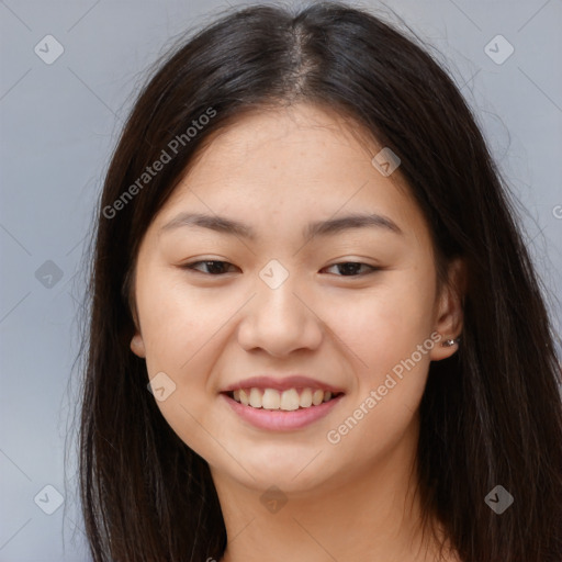 Joyful asian young-adult female with long  brown hair and brown eyes