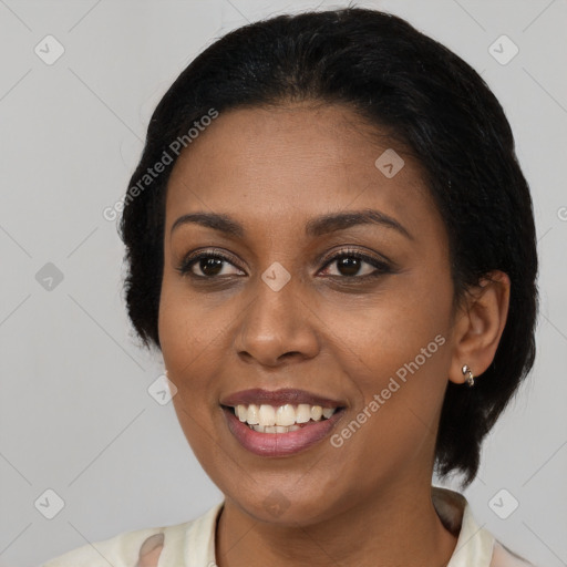 Joyful black young-adult female with medium  black hair and brown eyes