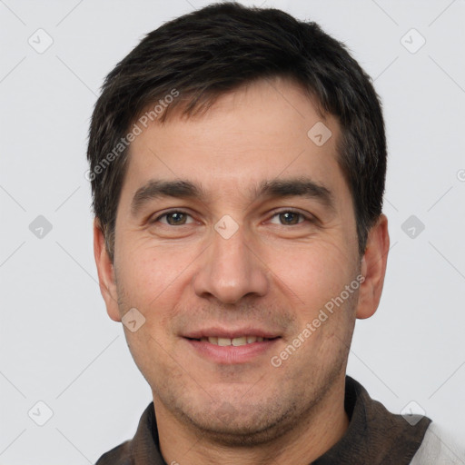 Joyful white young-adult male with short  black hair and brown eyes