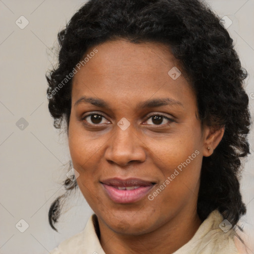 Joyful black adult female with medium  brown hair and brown eyes