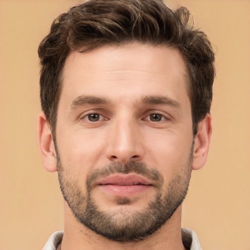 Joyful white young-adult male with short  brown hair and brown eyes