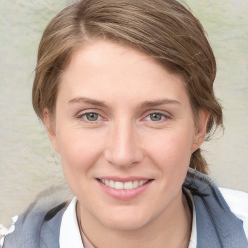 Joyful white young-adult female with medium  brown hair and blue eyes