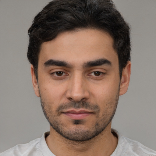 Neutral white young-adult male with short  black hair and brown eyes