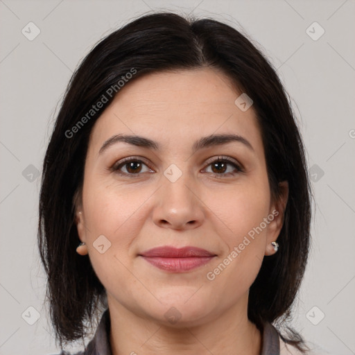 Joyful white adult female with medium  brown hair and brown eyes