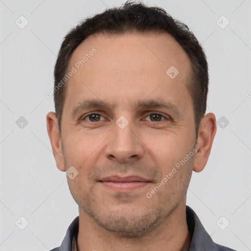 Joyful white adult male with short  brown hair and brown eyes