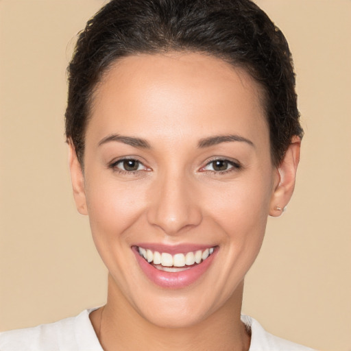 Joyful white young-adult female with short  brown hair and brown eyes