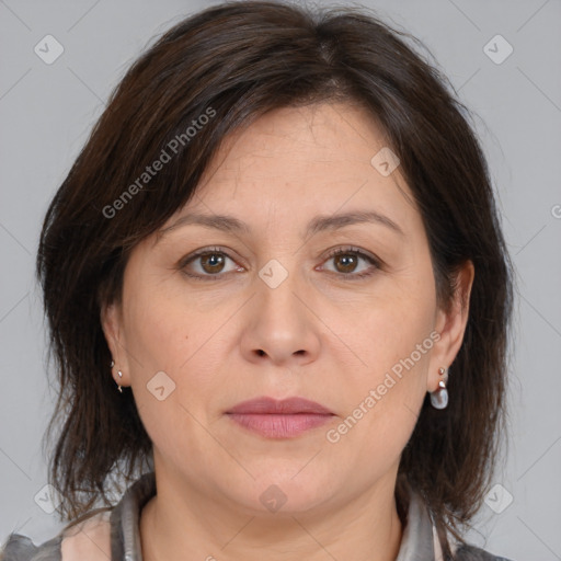 Joyful white adult female with medium  brown hair and brown eyes