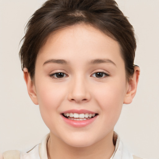 Joyful white child female with short  brown hair and brown eyes