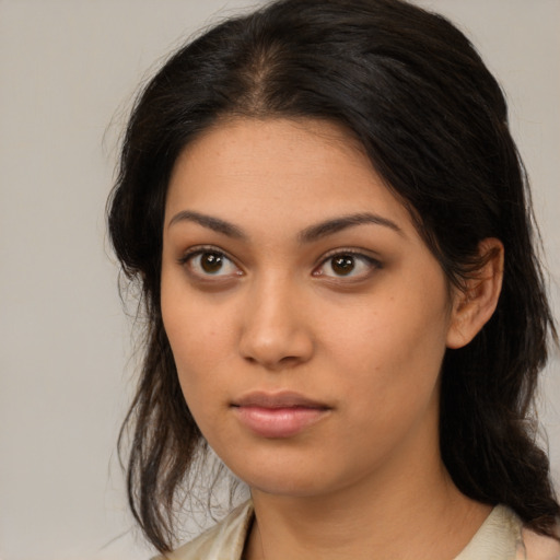 Neutral latino young-adult female with medium  brown hair and brown eyes
