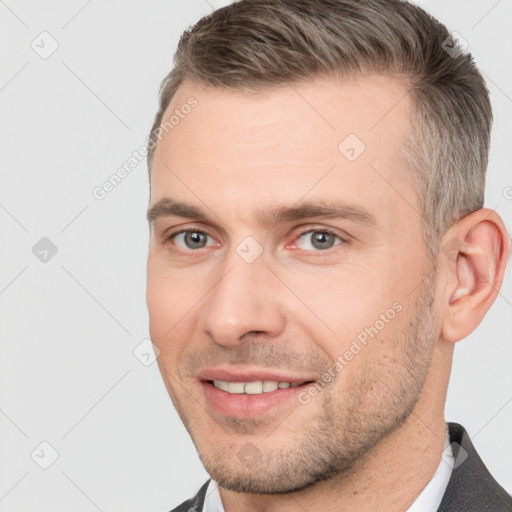 Joyful white adult male with short  brown hair and brown eyes