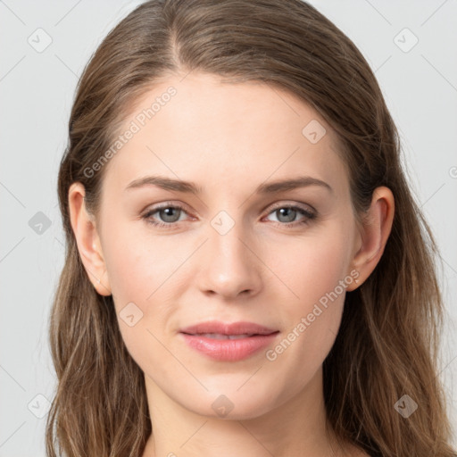 Joyful white young-adult female with long  brown hair and grey eyes