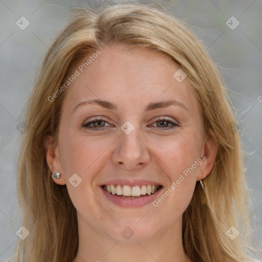 Joyful white adult female with medium  brown hair and blue eyes