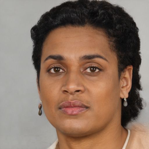 Neutral latino young-adult female with short  black hair and brown eyes