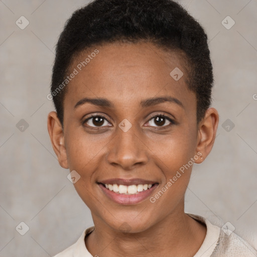 Joyful black young-adult female with short  brown hair and brown eyes