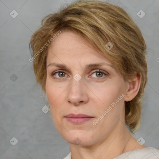 Joyful white adult female with medium  brown hair and blue eyes