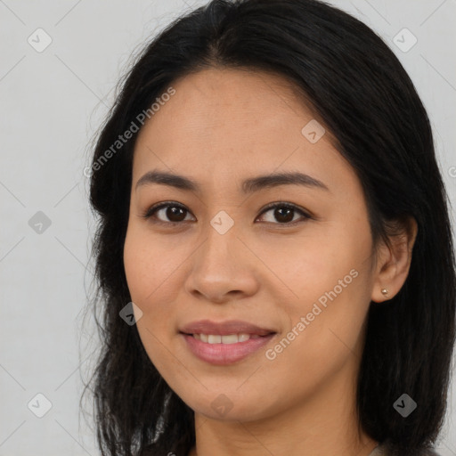 Joyful asian young-adult female with long  brown hair and brown eyes