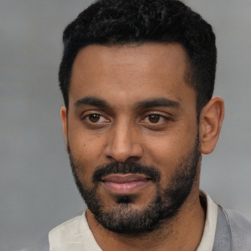 Neutral black young-adult male with short  black hair and brown eyes