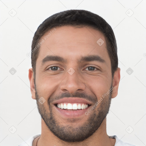 Joyful white young-adult male with short  black hair and brown eyes