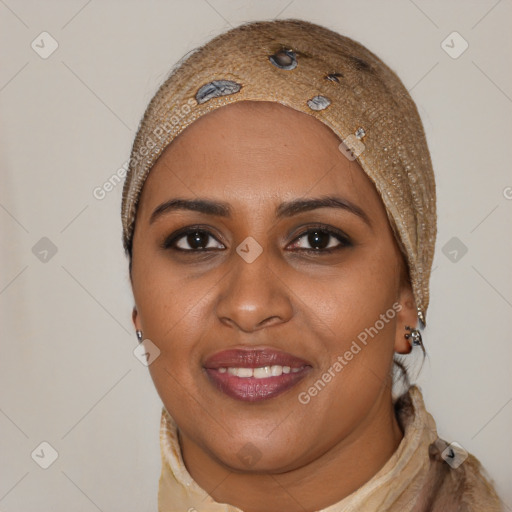 Joyful black young-adult female with long  brown hair and brown eyes