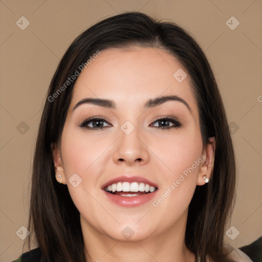 Joyful white young-adult female with long  black hair and brown eyes