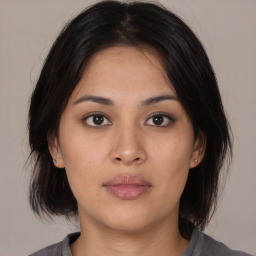 Neutral asian young-adult female with medium  brown hair and brown eyes