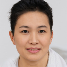 Joyful asian young-adult female with short  brown hair and brown eyes