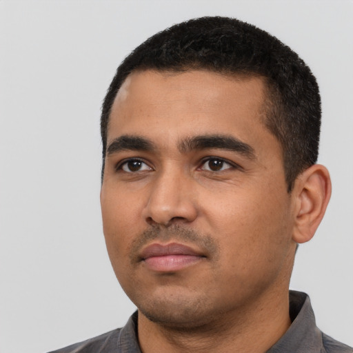 Neutral latino young-adult male with short  black hair and brown eyes