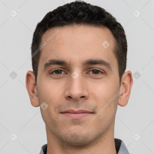 Joyful white young-adult male with short  brown hair and brown eyes