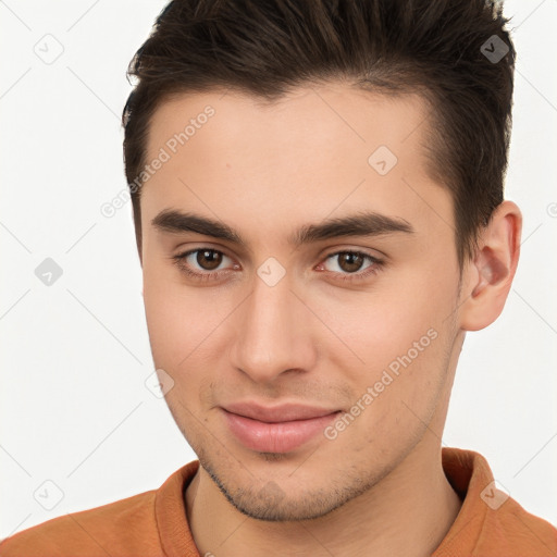 Joyful white young-adult male with short  brown hair and brown eyes