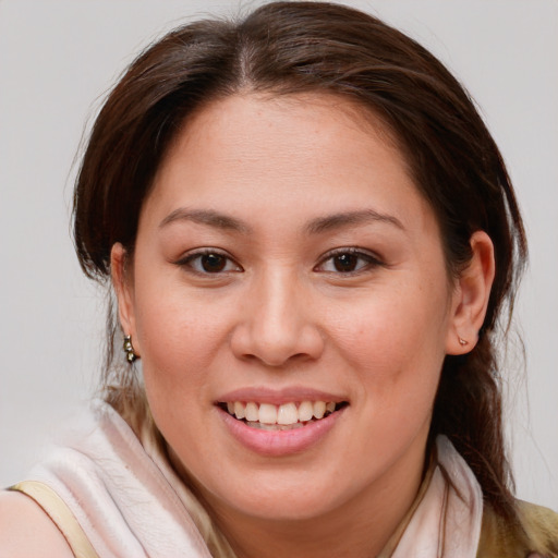 Joyful white young-adult female with medium  brown hair and brown eyes