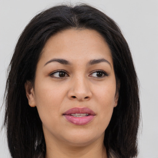 Joyful asian young-adult female with long  brown hair and brown eyes