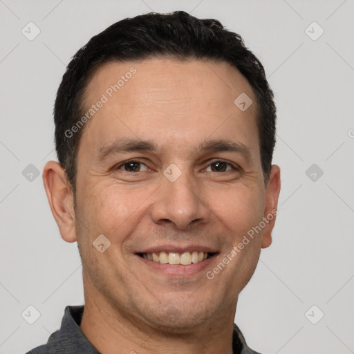 Joyful white adult male with short  brown hair and brown eyes