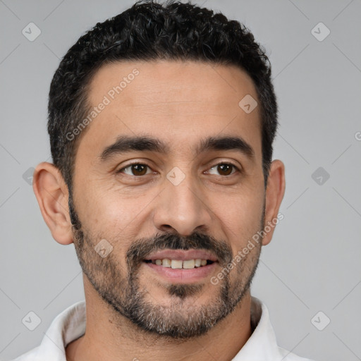 Joyful white young-adult male with short  black hair and brown eyes