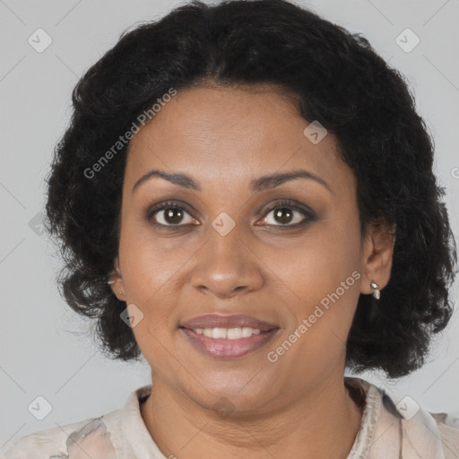 Joyful black young-adult female with medium  brown hair and brown eyes