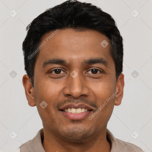 Joyful latino young-adult male with short  black hair and brown eyes