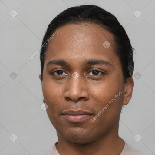 Joyful black young-adult male with short  black hair and brown eyes