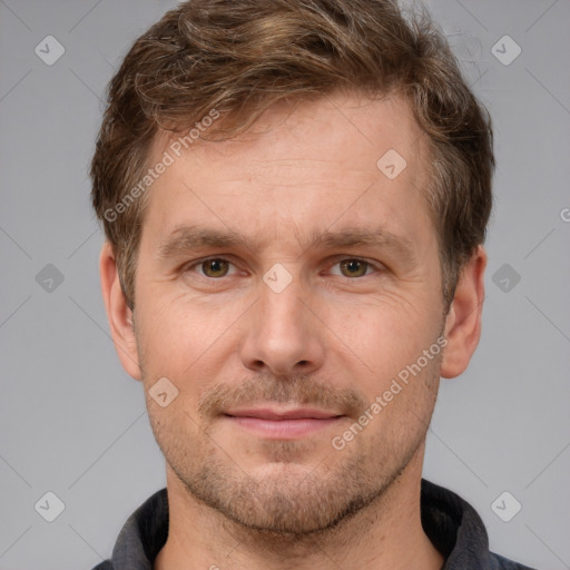 Joyful white adult male with short  brown hair and brown eyes