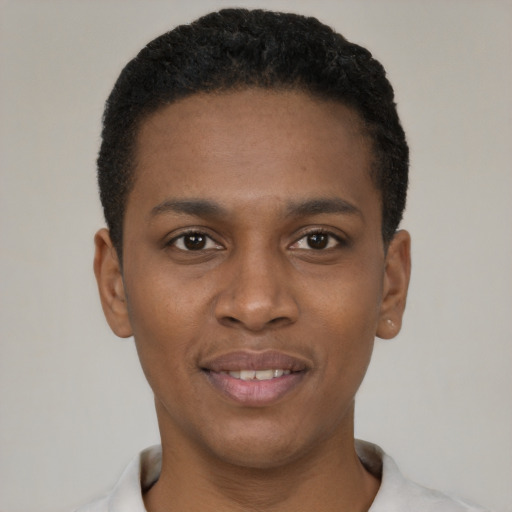 Joyful black young-adult male with short  black hair and brown eyes