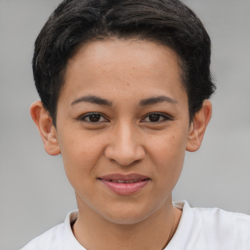 Joyful latino young-adult female with short  brown hair and brown eyes