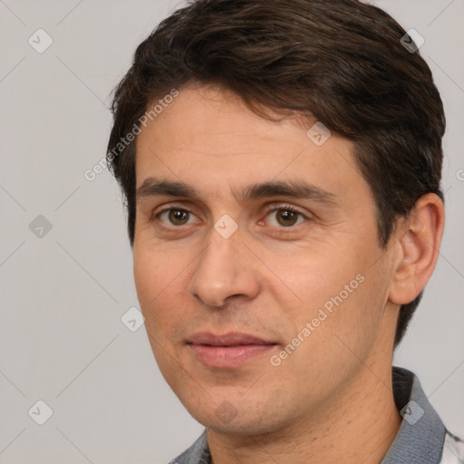 Joyful white adult male with short  brown hair and brown eyes