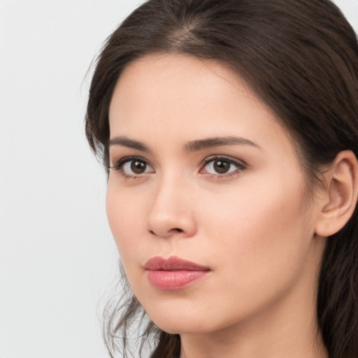 Neutral white young-adult female with medium  brown hair and brown eyes