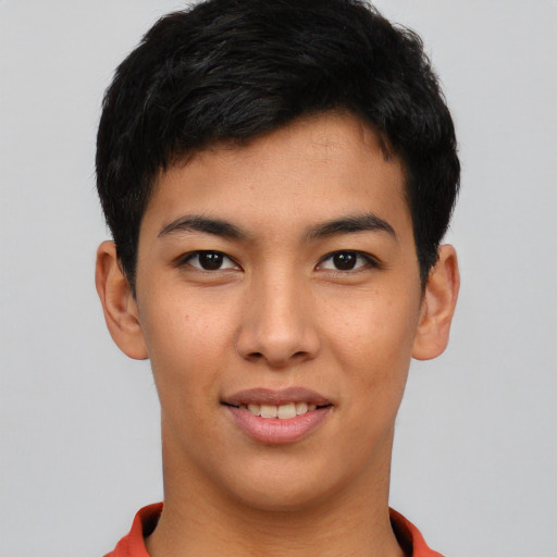 Joyful asian young-adult male with short  black hair and brown eyes