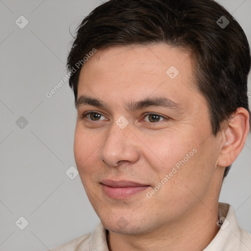 Joyful white young-adult male with short  brown hair and brown eyes