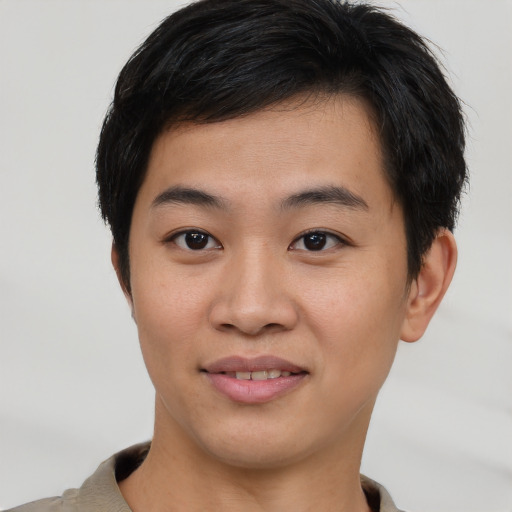 Joyful asian young-adult male with short  brown hair and brown eyes