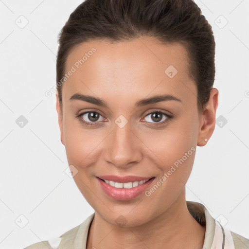 Joyful white young-adult female with short  brown hair and brown eyes