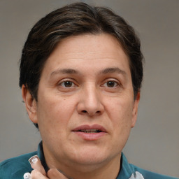 Joyful white adult female with short  brown hair and grey eyes